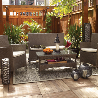 Deck tiles, furniture, palm trees, and decorative items complete the outdoor space. 