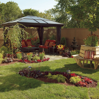 Gazebo, tree bench, fresh plantings, a fence, and outdoor furniture. 