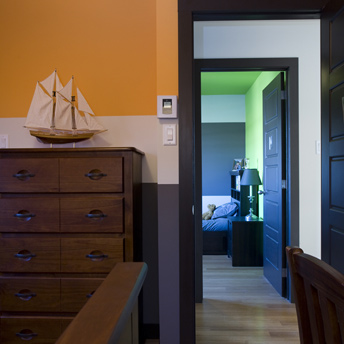 If a room lacks architectural details, consider adding interest with multiple paint colours