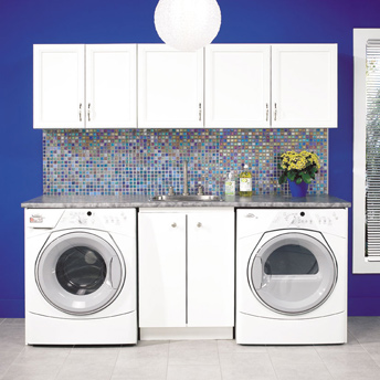 Vibrant laundry room with work space and cabinets