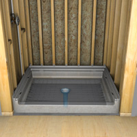 The shower base is levelled and placed on a bed of pre-mixed mastic or sand-mixed concrete to hold it.