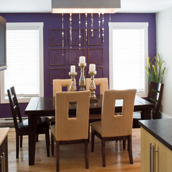 Dining room with an accent purple wall