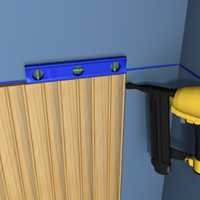 Apply a wavy line of adhesive along the back and drive the nails through the tongue of the wainscot board.