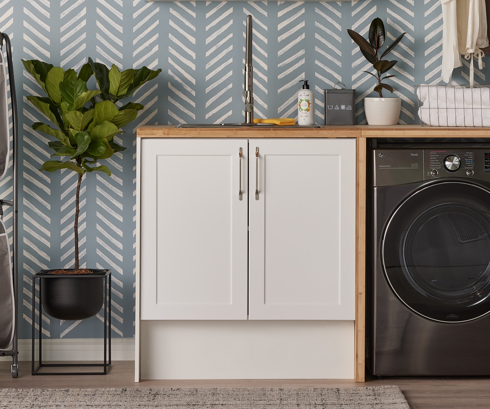 White storage cabinets in a laundry room