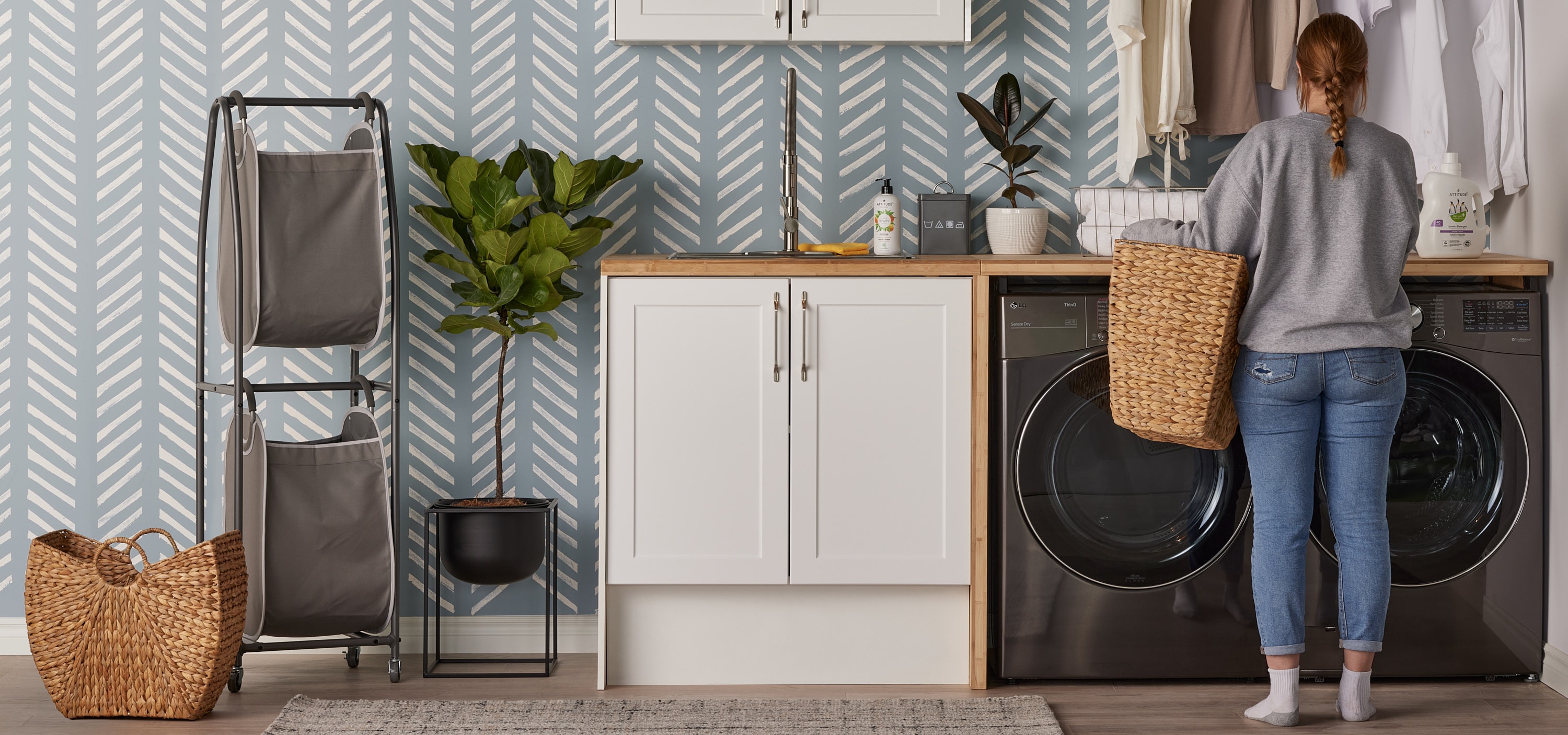 Young woman in a boho-style laundry room Young woman in a boho-style laundry room