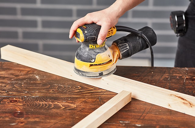 Person using an orbital sander