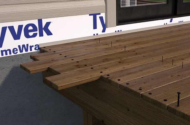 Planks of pressure treated wood on a deck