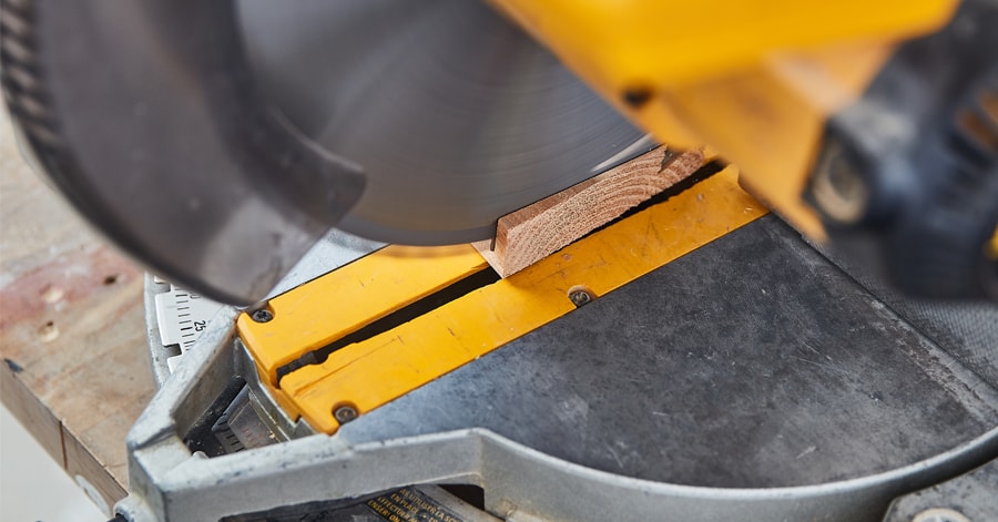 Mitre saw cutting wood at an angle