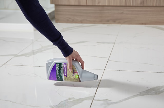 Person pouring a cleaning product on a ceramic floor