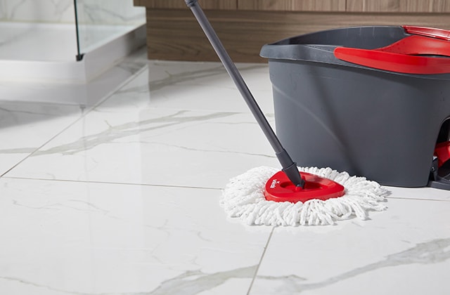 Mop and bucket on a ceramic floor