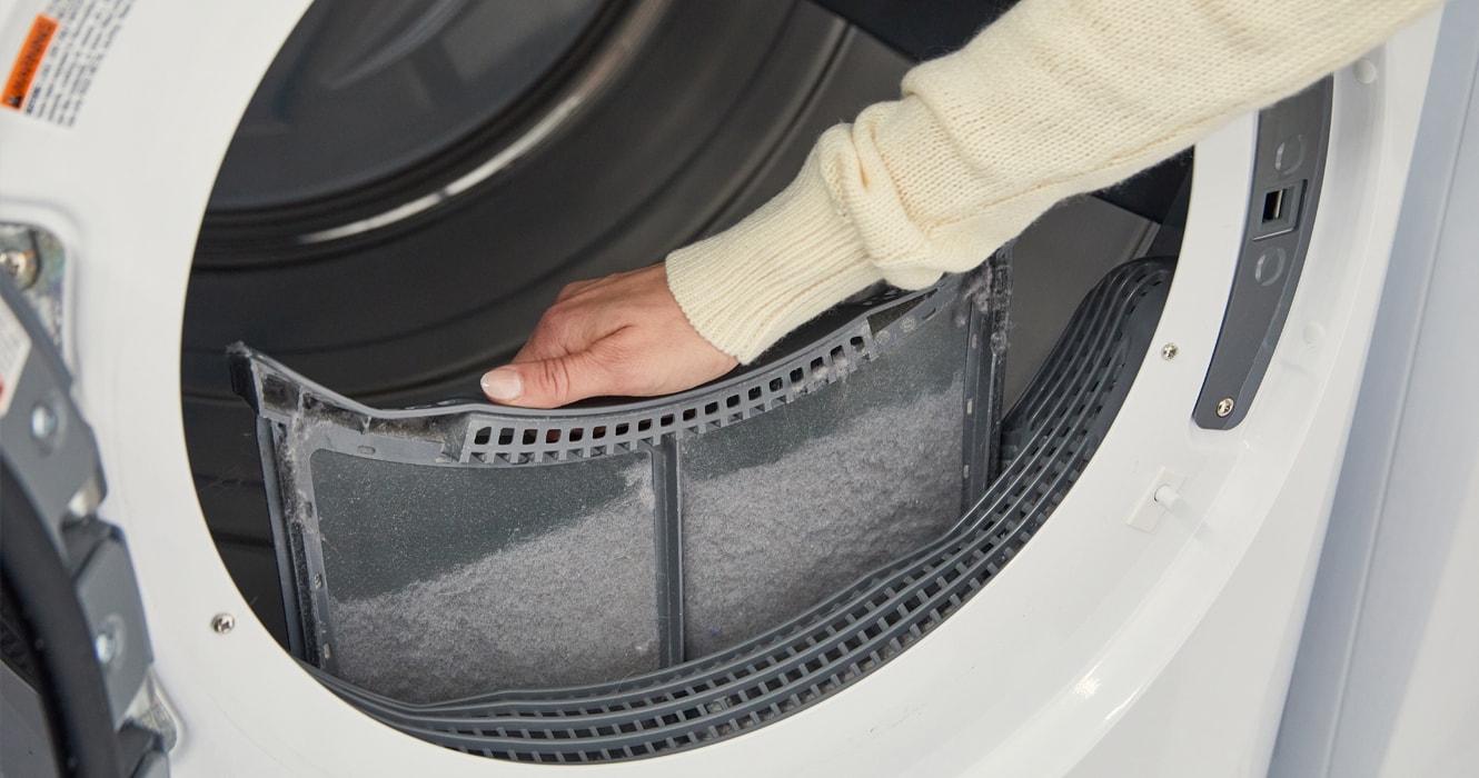 Person removing a lint filter