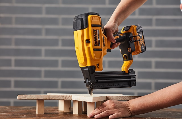 Person using a power nailer