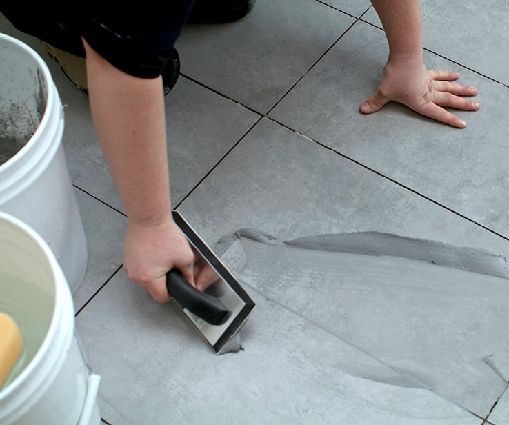 Person applying grout