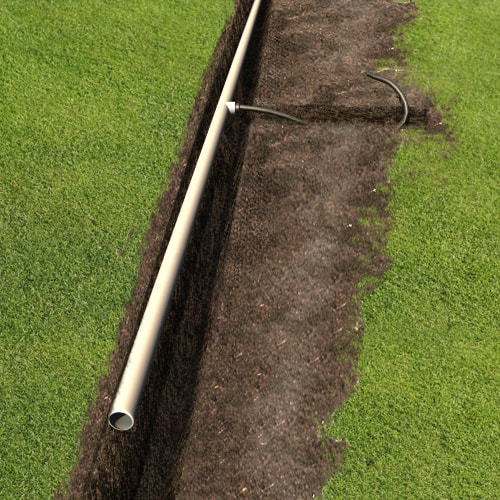 Wide trench with a white pipe Wide trench with a white pipe