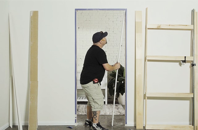 Person removing a door frame