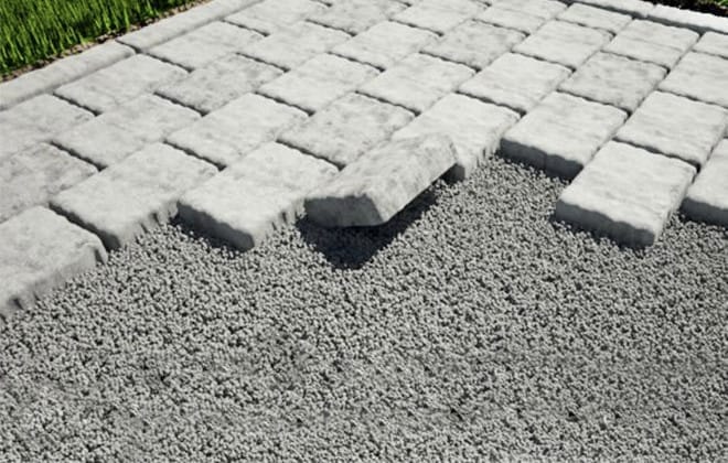 Patio stones set out on a paver setting bed