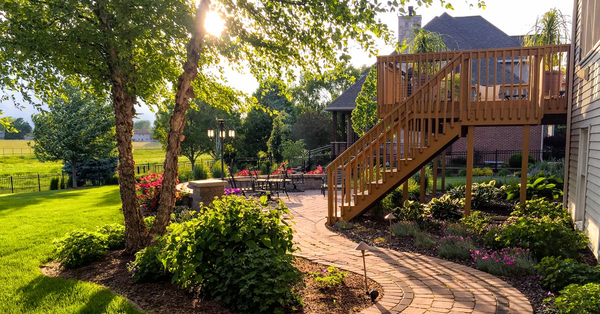 Lay concrete pavers or patio slabs