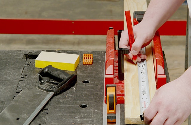 Person measuring wood