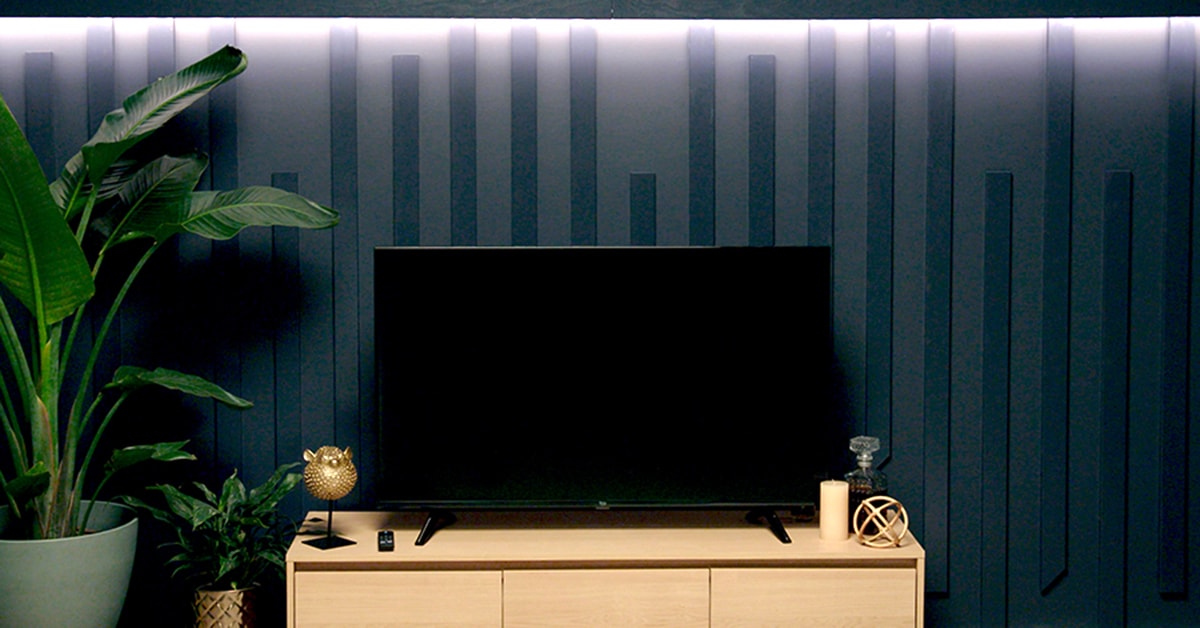 Home theatre with a lighted moulding accent wall