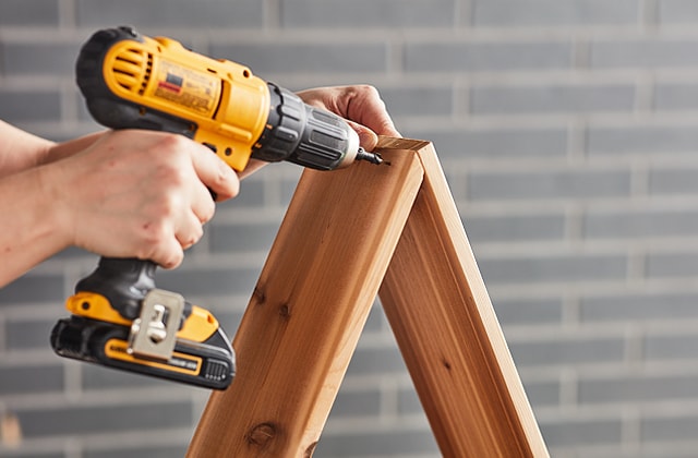 Person using and electric screwdriver