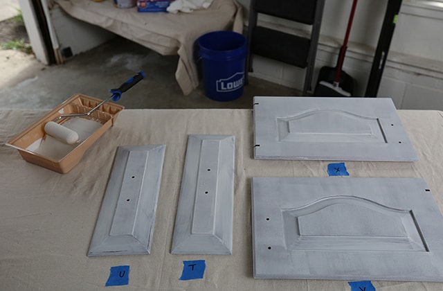 Primed kitchen cabinet doors with labels