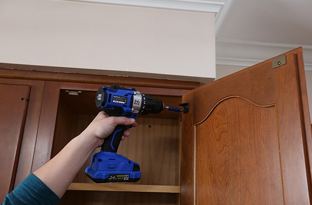 Person removing kitchen cabinet doors