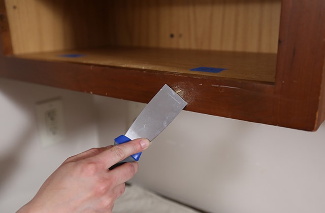 Person using a putty knife