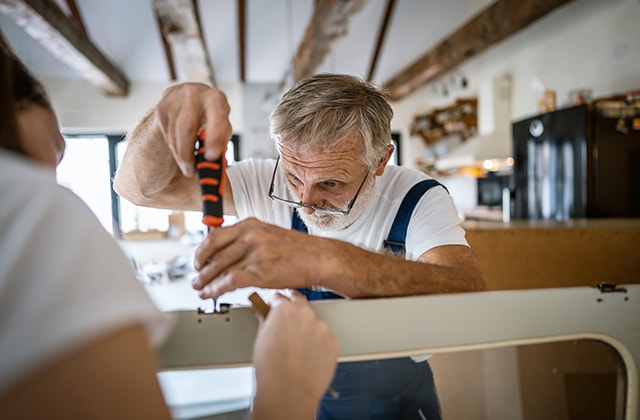 Man disassembling furniture