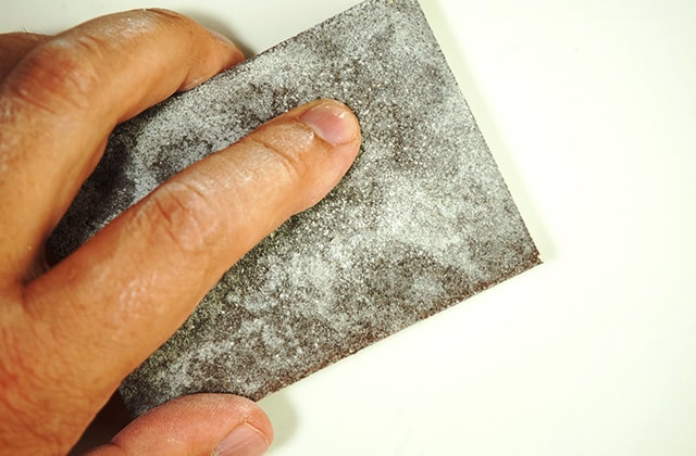 Person sanding furniture