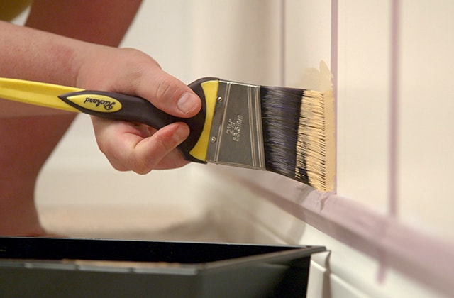 Person trimming a moulding