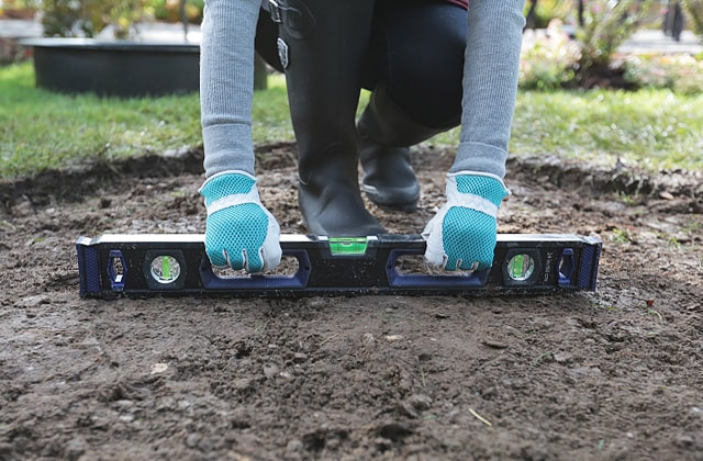 Prepare the soil for the backyard fire pit