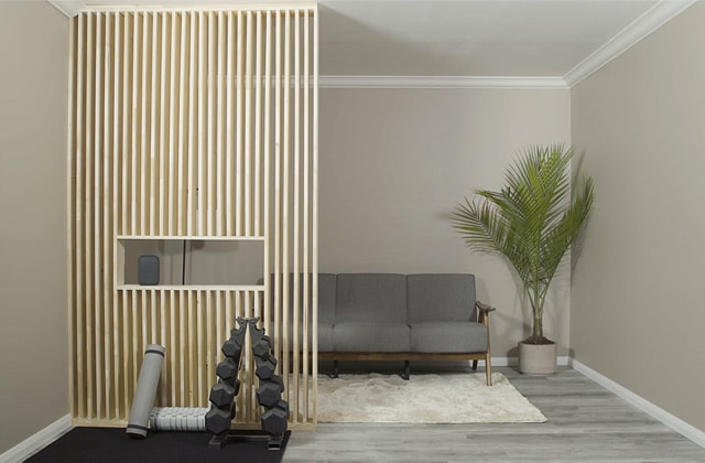 Wooden room divider wall in a basement