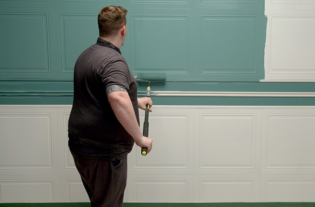 Person painting a 3D wall