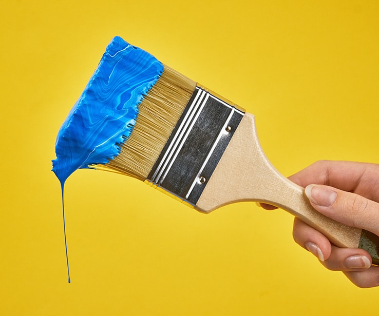 Paint brush with blue paint