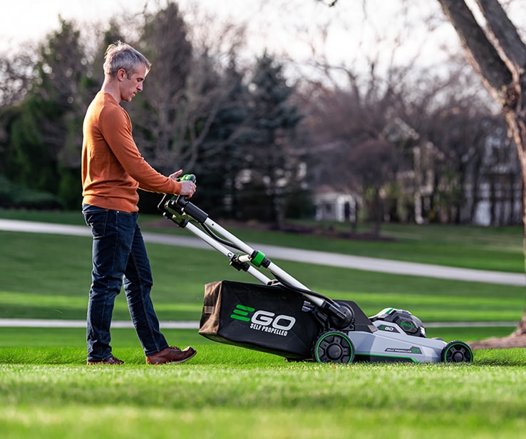 Person using a lawn mower