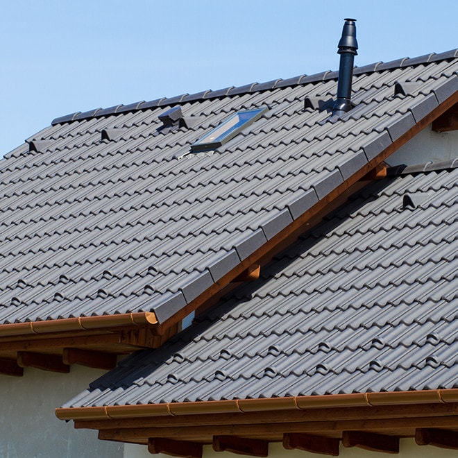 Roof covered with concrete tiles