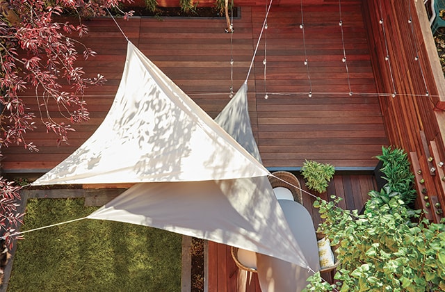 Two solar shades above a deck