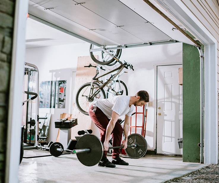 Man working out in a garage Man working out in a garage
