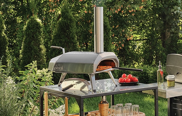 An outdoor pizza oven in a backyard