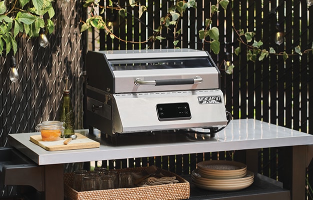 A portable BBQ in a backyard