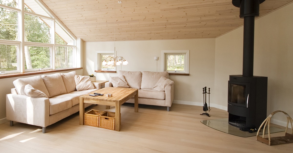 Matte black wood stove in a bright living room Matte black wood stove in a bright living room