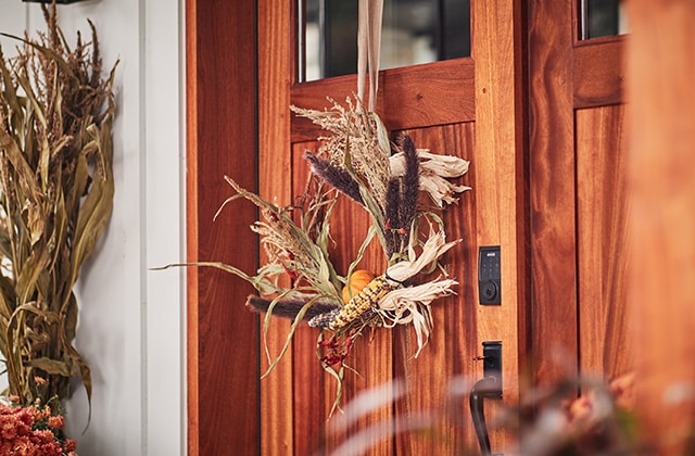Exterior door with a fall-coloured wreath