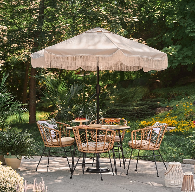 Outdoor furniture with a boho umbrella Outdoor furniture with a boho umbrella
