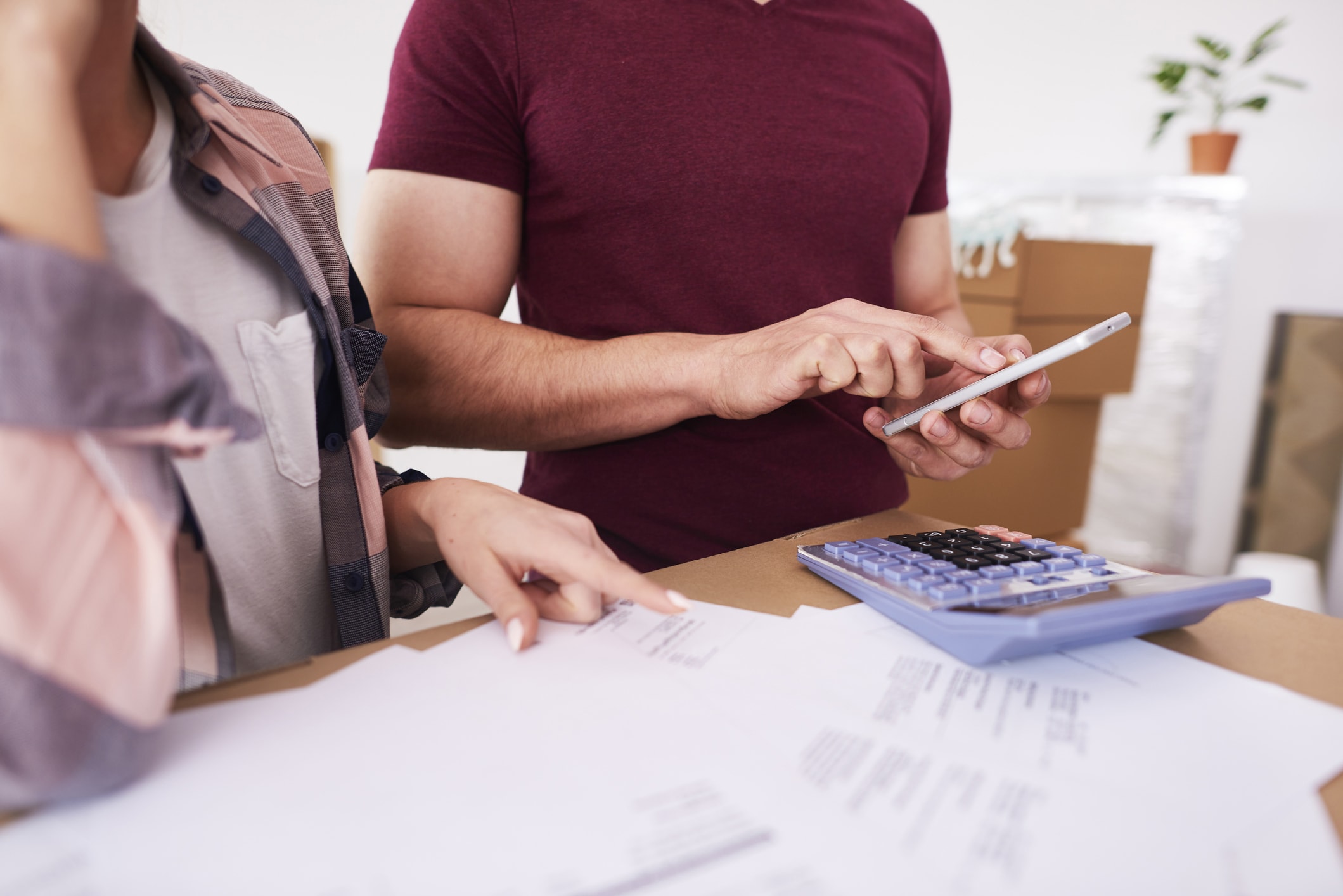 Couple calculating a budget Couple calculating a budget