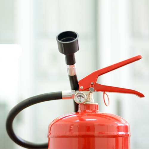 Top part of a fire extinguisher Top part of a fire extinguisher