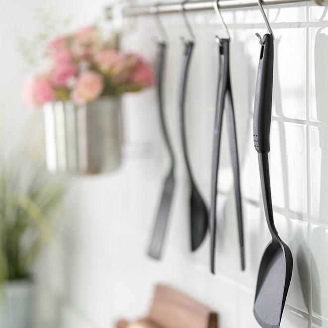 Kitchen accessories hanging on a wall Kitchen accessories hanging on a wall