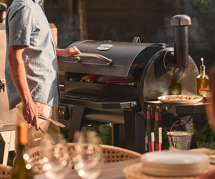 Man using a barbecue Man using a barbecue