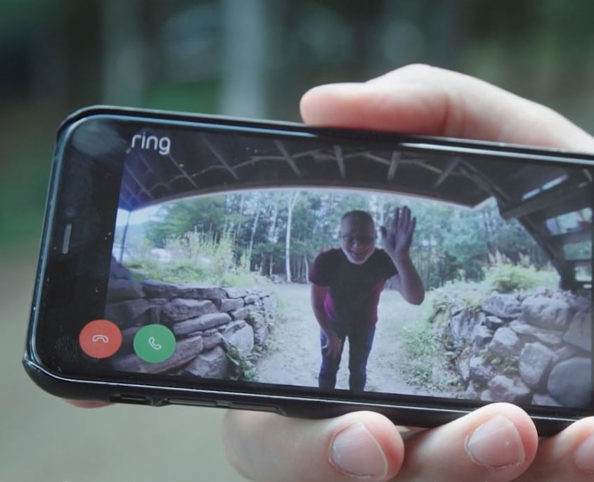 Smart phone showing a video of a man waving Smart phone showing a video of a man waving