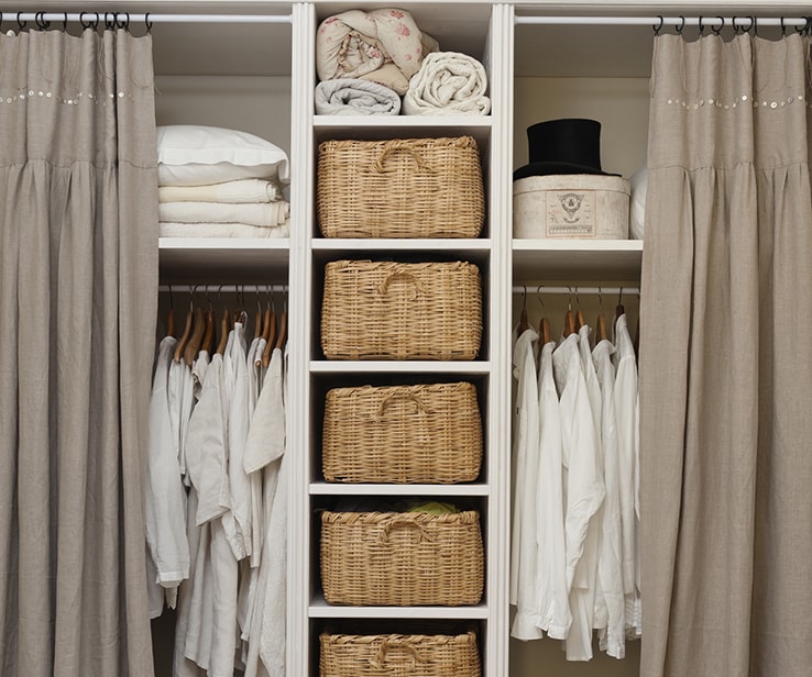 Closet with wicker boxes