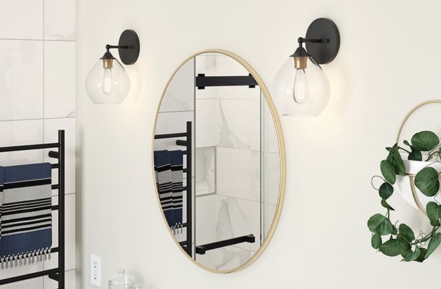 Round bathroom mirror with a brass finish